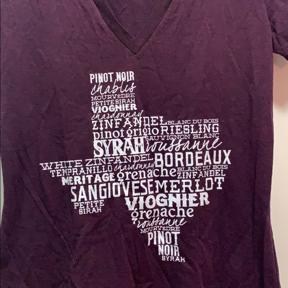 Dark v-neck with wine names in shape of Texas